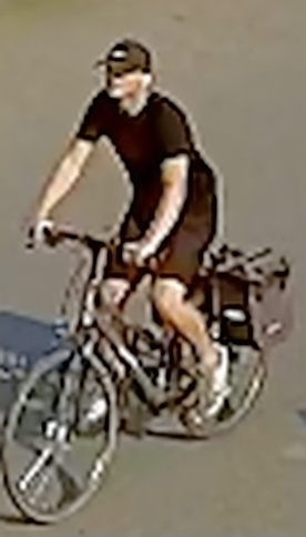 wizerunek poszukiwanego- mężczyzna w czarnym ubraniu na rowerze